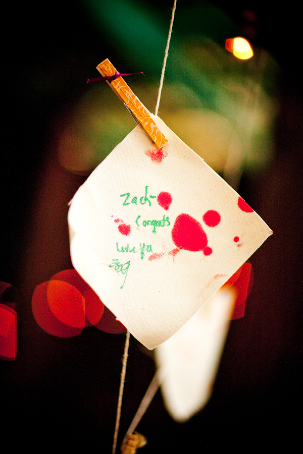 note to the bride and groom from guest hanging while pinned to a line - photo by New Mexico based wedding photographers Twin Lens